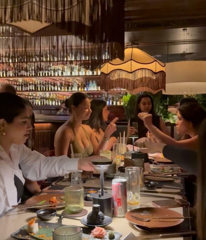 Founder's Table guests at a candlelit bar